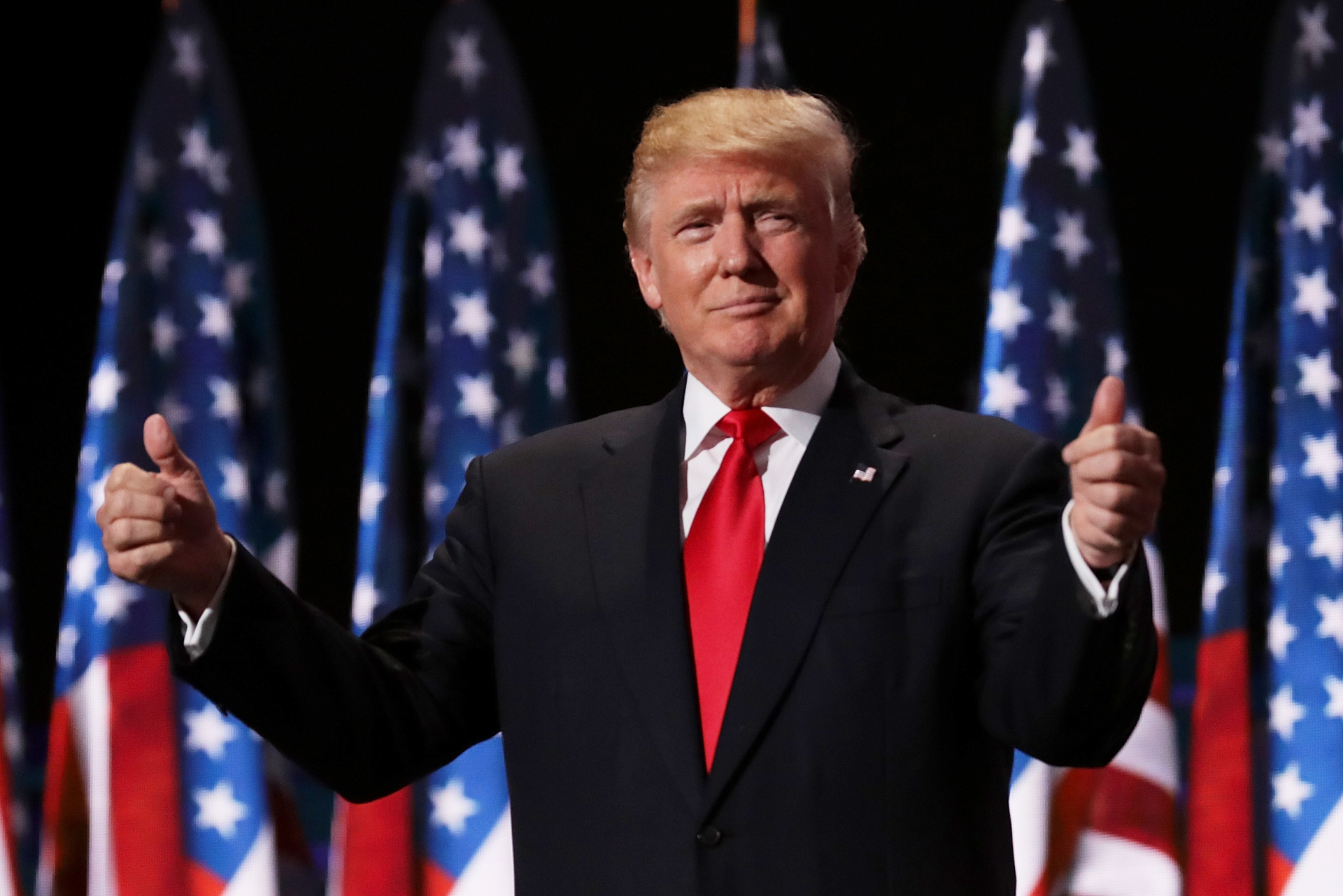 Republican presidential candidate Donald Trump gives two thumbs up to the crowd during the evening session on the fourth day of the Republican National Convention on July 21 2016 at the Quicken Loans Arena in Cleveland Ohio
