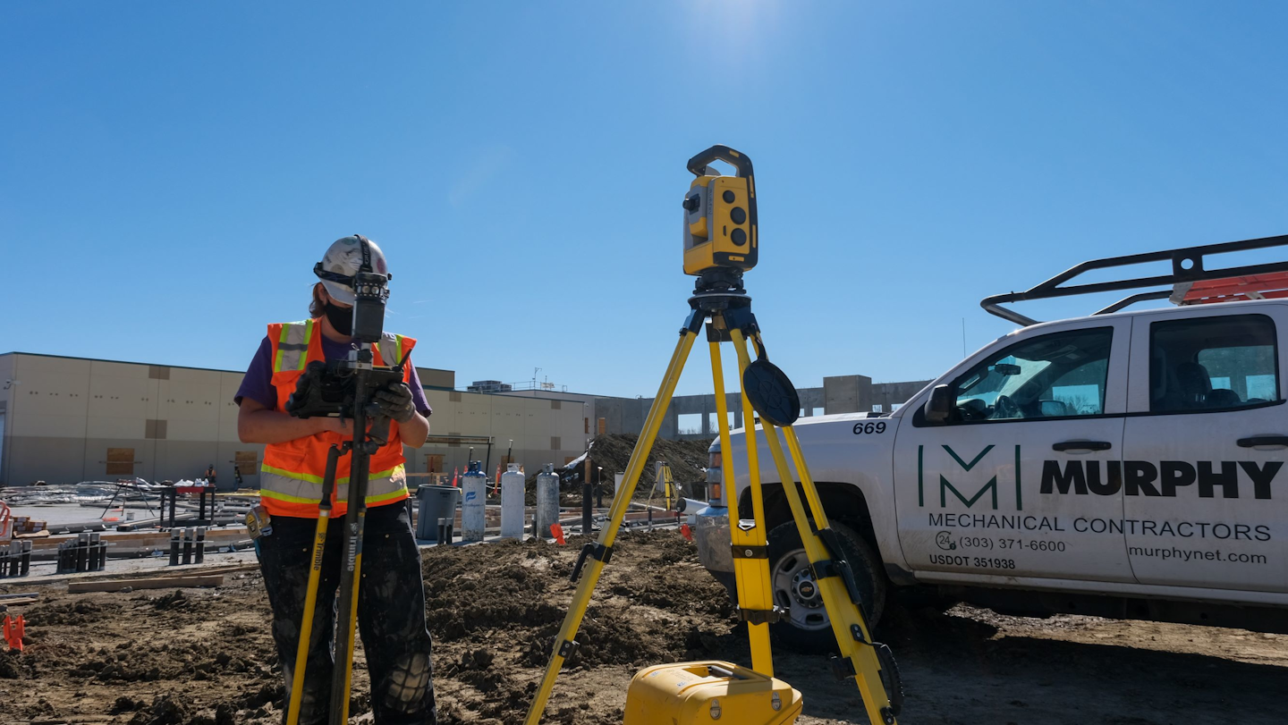 Sarah Harkssen (Plumbing Apprentice) out logging numbers at the job site.