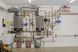 Wall-hung boilers from Lochinvar saved space in the mechanical room. Wall-hung boilers from Lochinvar saved space in the mechanical room.