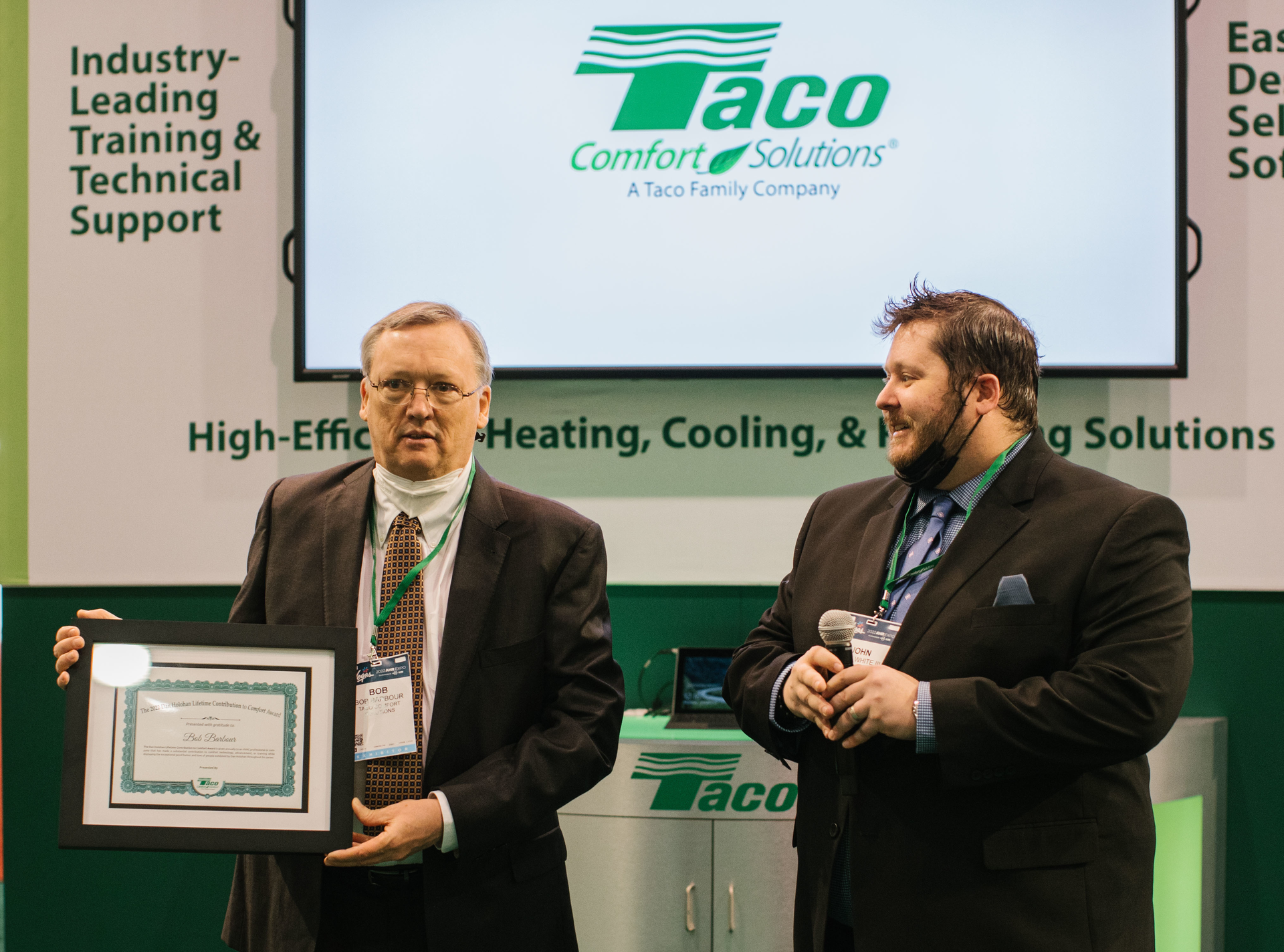 John Hazen White III presents the Dan Holohan Award to Bob Barbour at AHR Expo 2022 in Las Vegas.