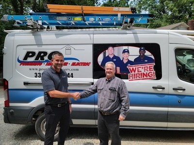 Jarrod Brinker, Chief Strategy Officer at Southern HVAC, shakes hands with Thad Hedrick, President & Founder of Pro Plumbing Services, LLC.