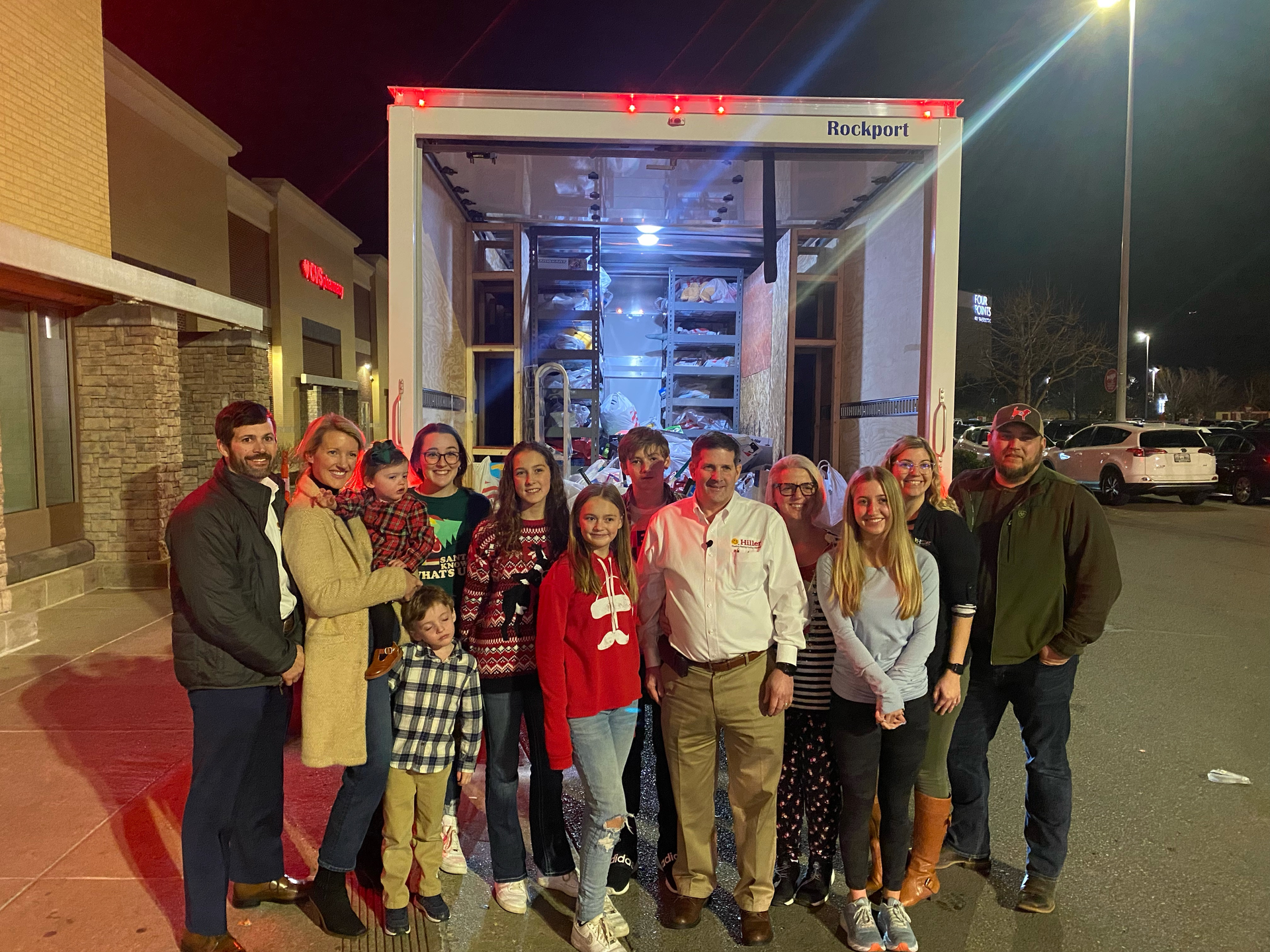 Jimmy Hiller and the Hiller family with a truckful of toys to donate after shopping spree.