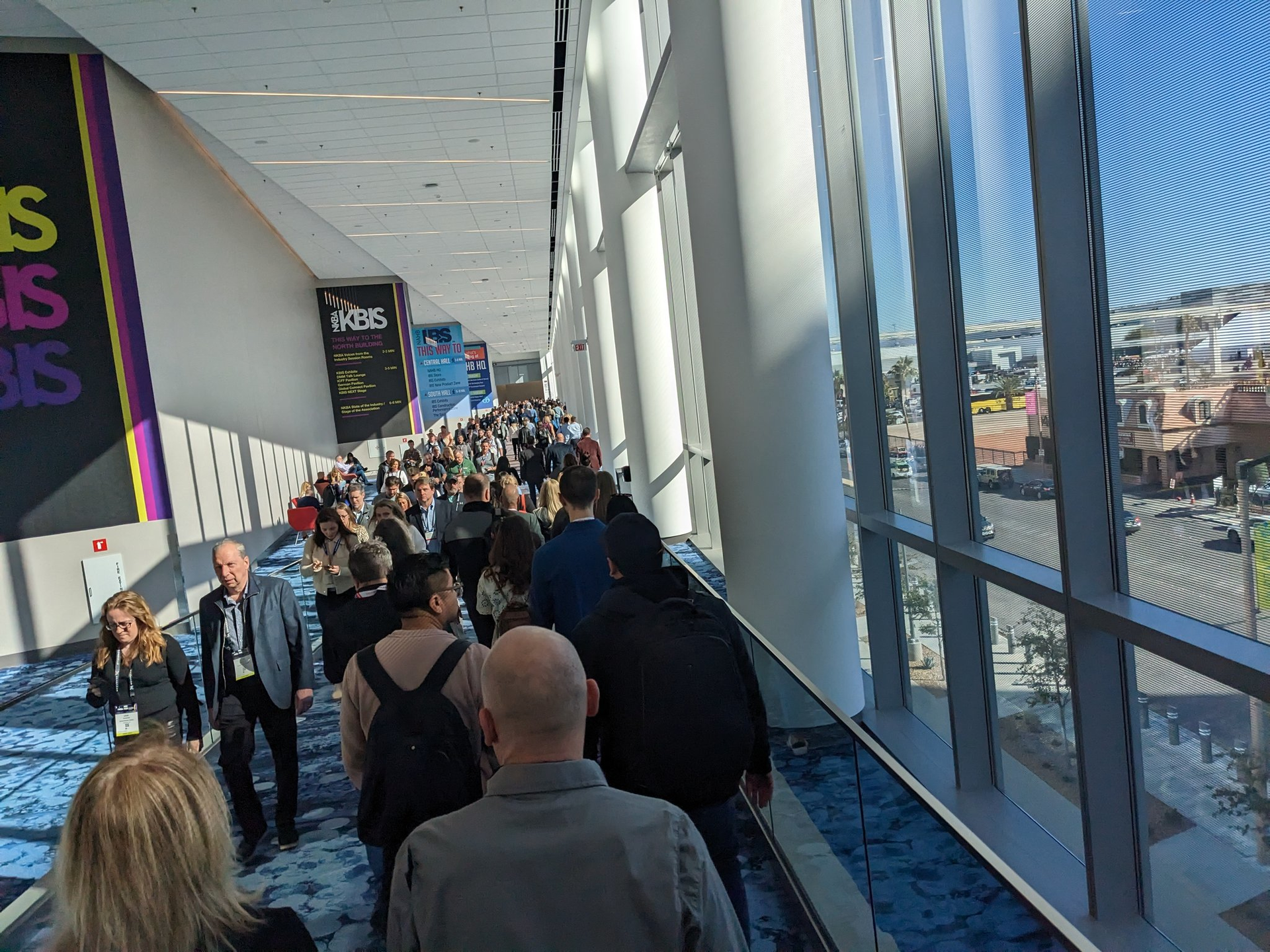 Crowds walk the long passage between W hall and N halls at Design and Construction Week.