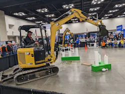 Competitors in the backhoe ROE-D-HOE show off their precision skills at the WWETT Show. Competitors in the backhoe ROE-D-HOE show off their precision skills at the WWETT Show.