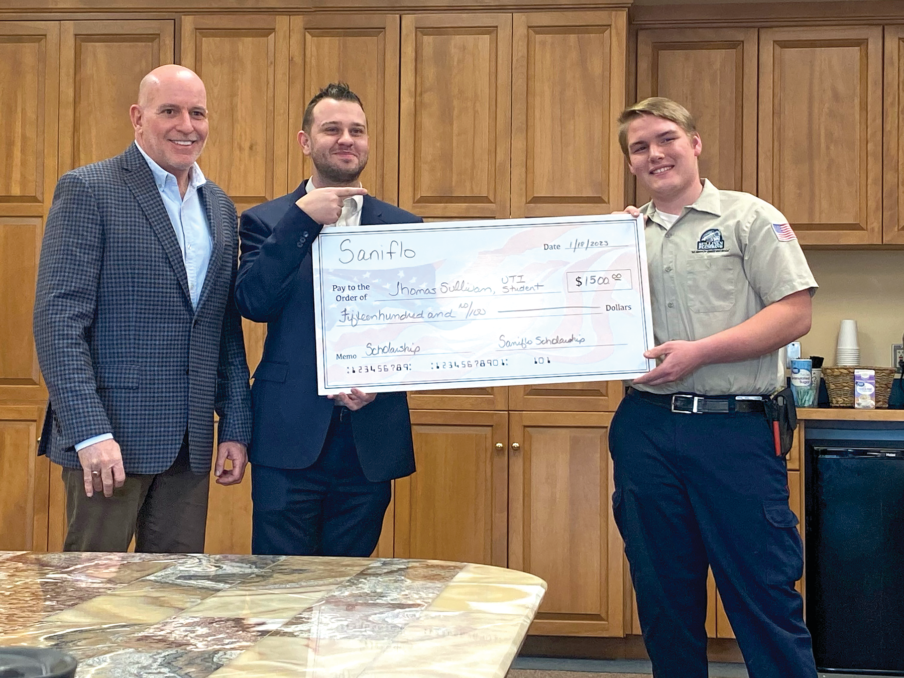 John Glass and Rob Weed of Saniflo SFA attended to congratulate Thomas on the award.
