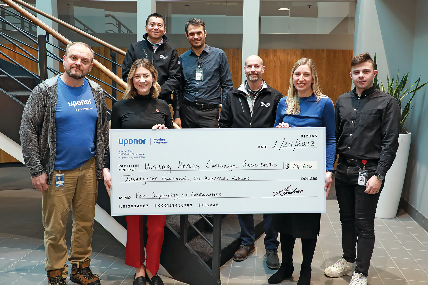 Recipients of the Uponor North America Unsung Heroes donations gathered in Apple Valley, Minn., to be honored with their donations. From L-R: Alex Khrystych, Sarah Qualy, David Nguyen, Yakov Gradinar, Nate Martineau, Aubrey Mozer, andYury Aroshidze.