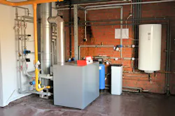 A residential gas boiler with storage tank. A residential gas boiler with storage tank.
