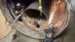 Boiler makers replacing the tubes and tube sheet in an industrial boiler. Boiler makers replacing the tubes and tube sheet in an industrial boiler.