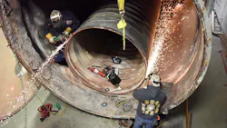 Boiler makers replacing the tubes and tube sheet in an industrial boiler. Boiler makers replacing the tubes and tube sheet in an industrial boiler.