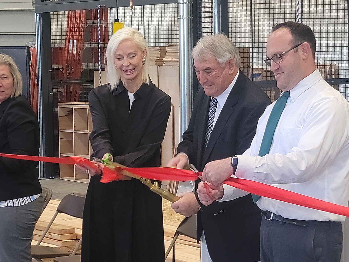 Opening ceremonies with Douglas Green doing the ribbon cutting. He is flanked on his right by his wife, Heather and on his left by Daniel Orrantia, Principle of the Evergreen School.