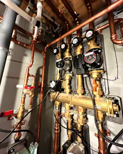 A bank of circulators distributing to the radiant floor zone. A bank of circulators distributing to the radiant floor zone.