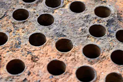 Mineral deposits, scale and corrosion on the plate of a heat exchanger. Mineral deposits, scale and corrosion on the plate of a heat exchanger.