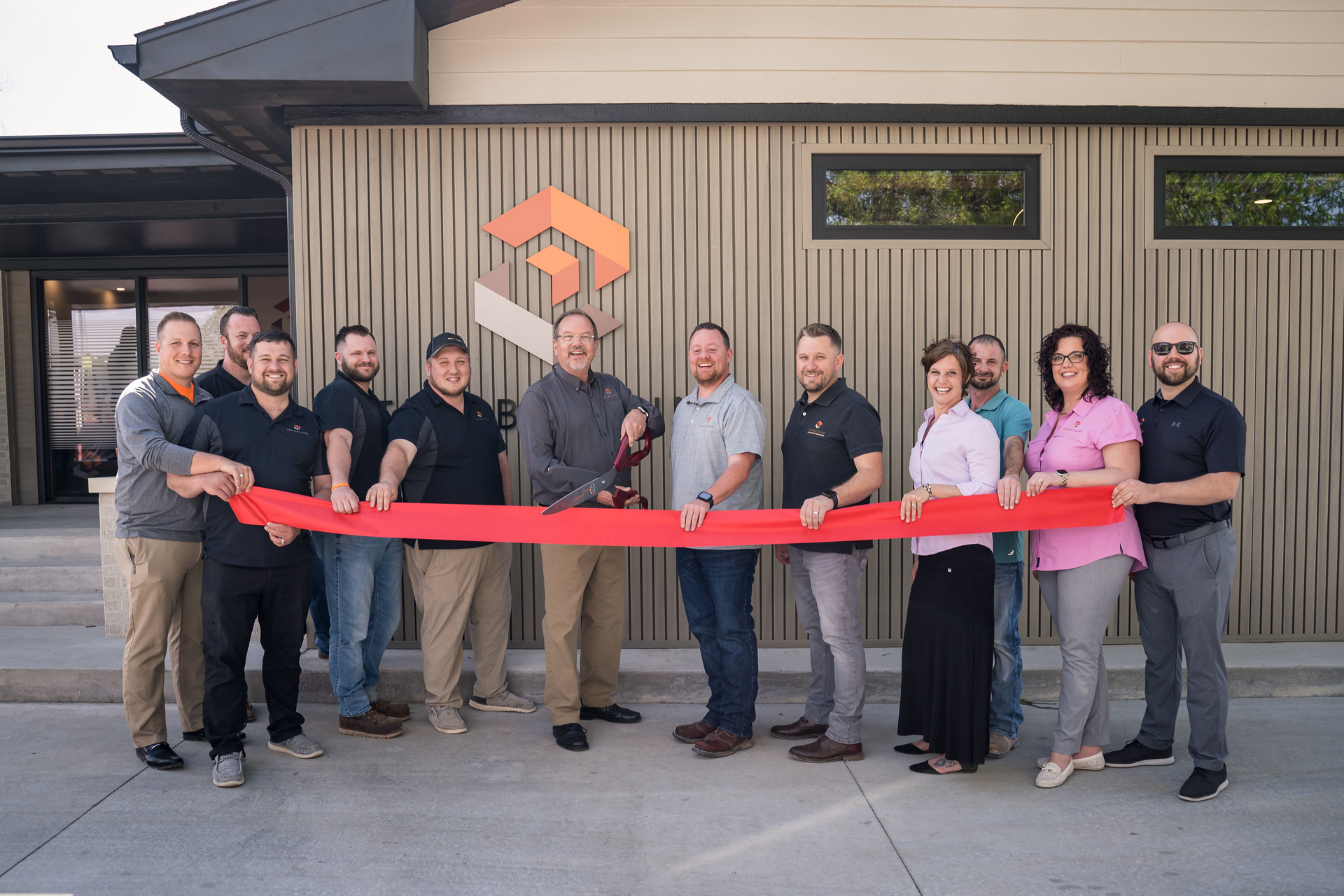 The TRU-Building crew at the grand opening of their new HQ.