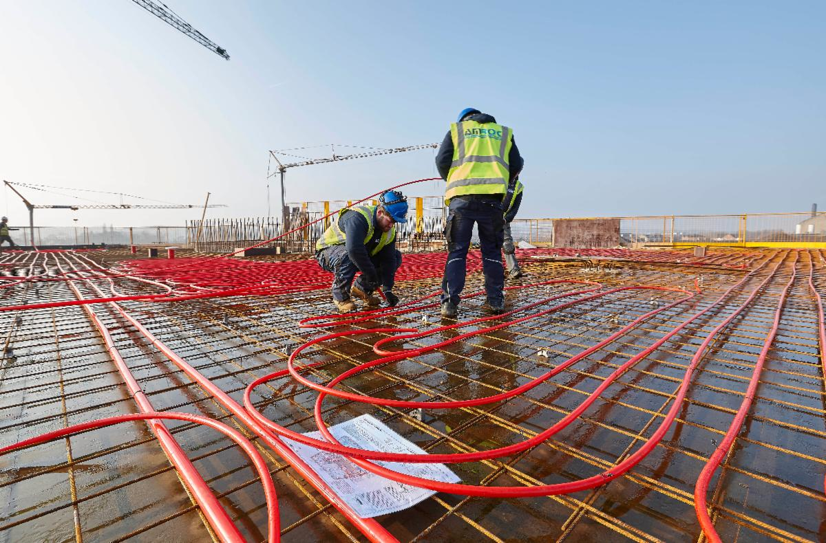 Technicians installing REHAU O2 Barrier pipe.