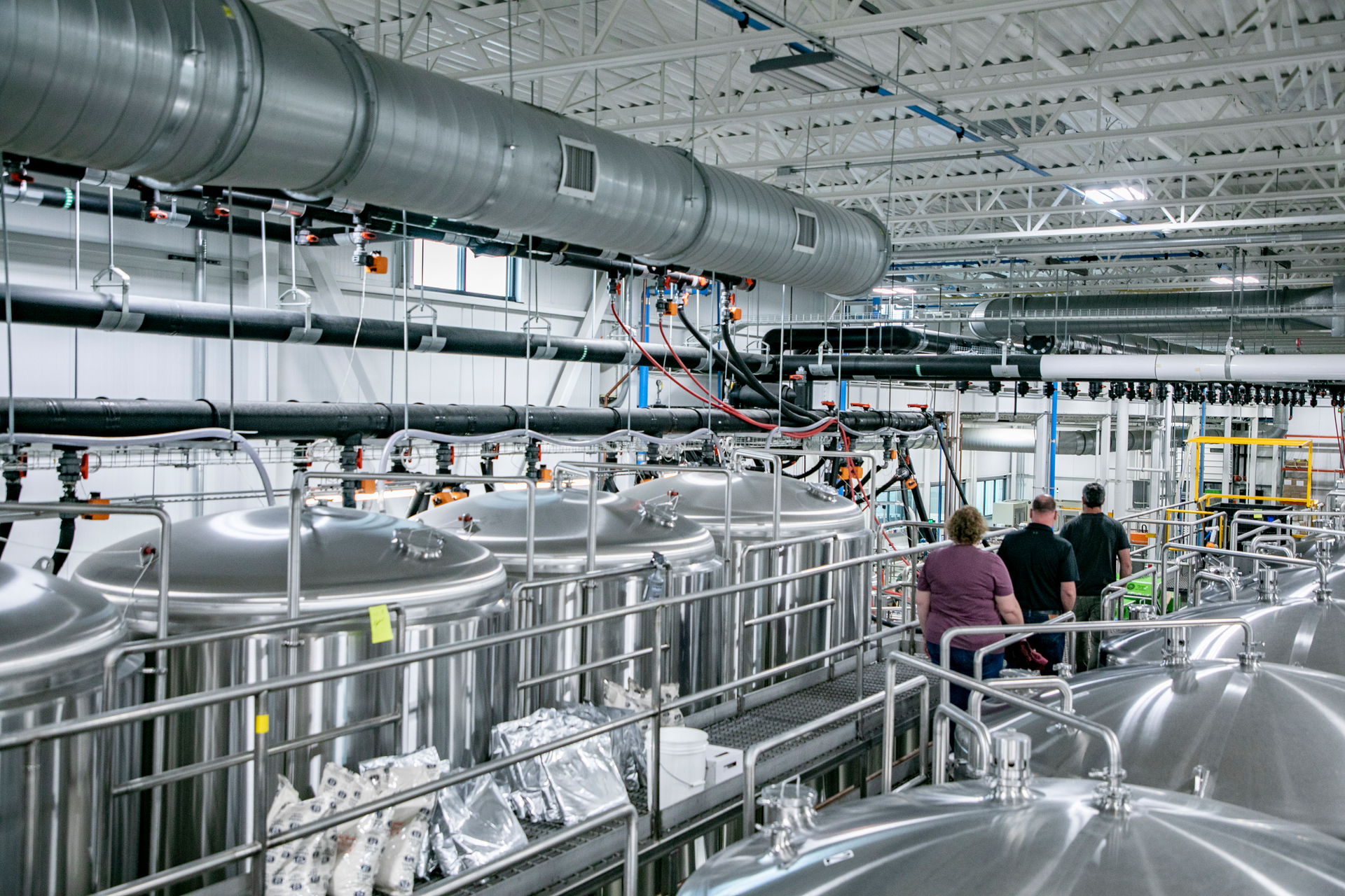 Angela Sampaio (National Sales Manager at GF) and Bob Tedder (Product Manager, Pre-insulated Piping Systems at GF) visit the Charlton facility with Luke Leger, Senior Maintenance Technician at Tree House Brewing. GF has provided Tree House with consistent technical support through several expansions of its COOL-FIT piping system.