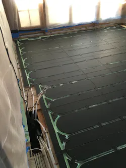 PEX tubing and Warmboard painted flat black to increase radiant heat transfer to the floating floor. PEX tubing and Warmboard painted flat black to increase radiant heat transfer to the floating floor.