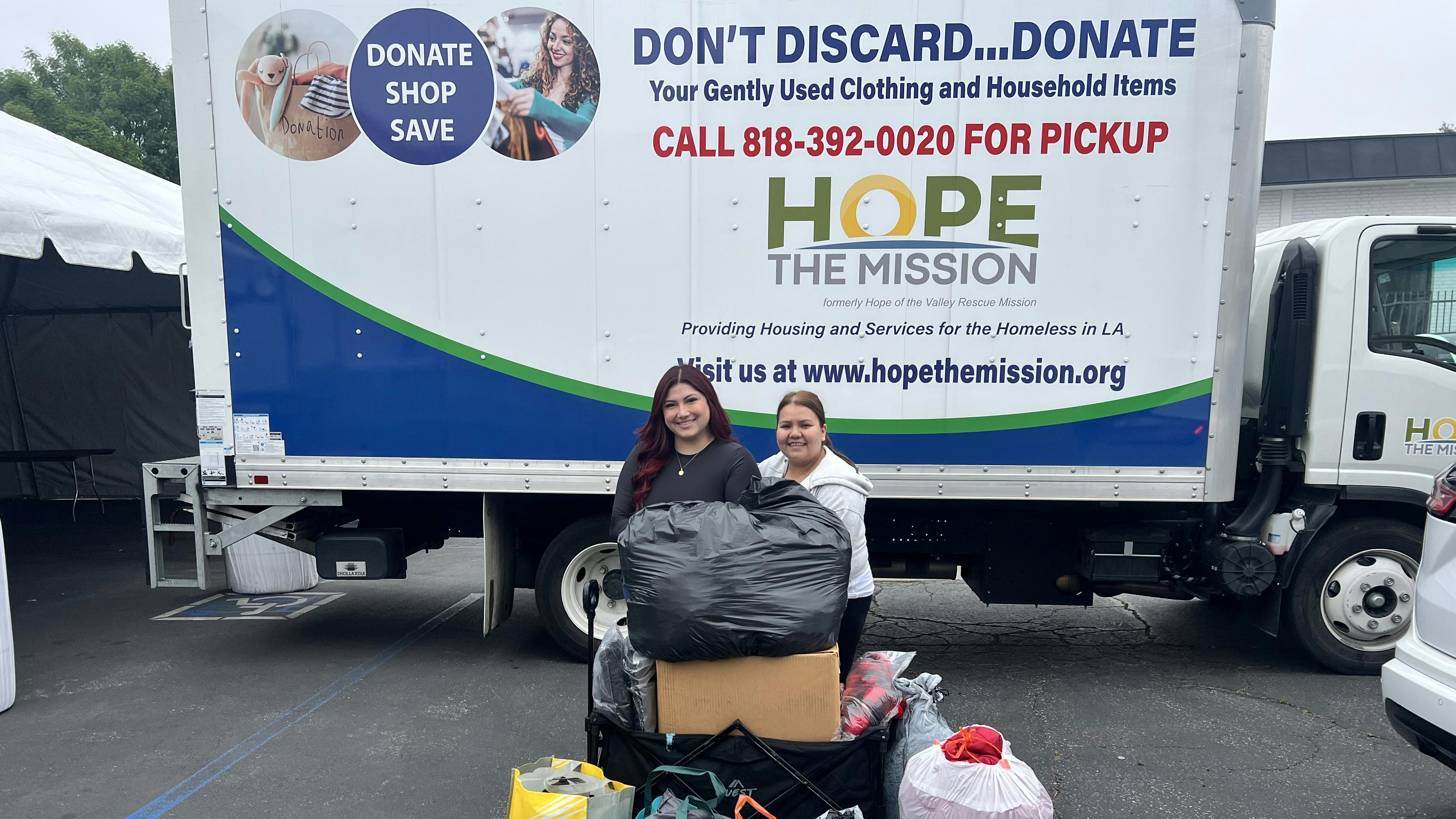 Rooter Hero employees with some of the collected clothing.