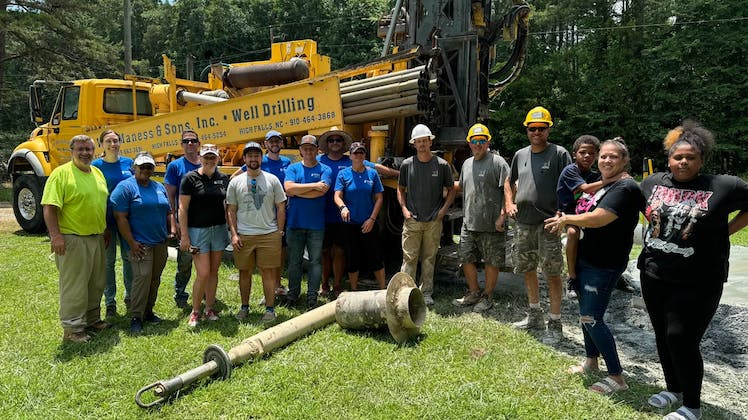 A group shot of the project team and members of the Sales family.