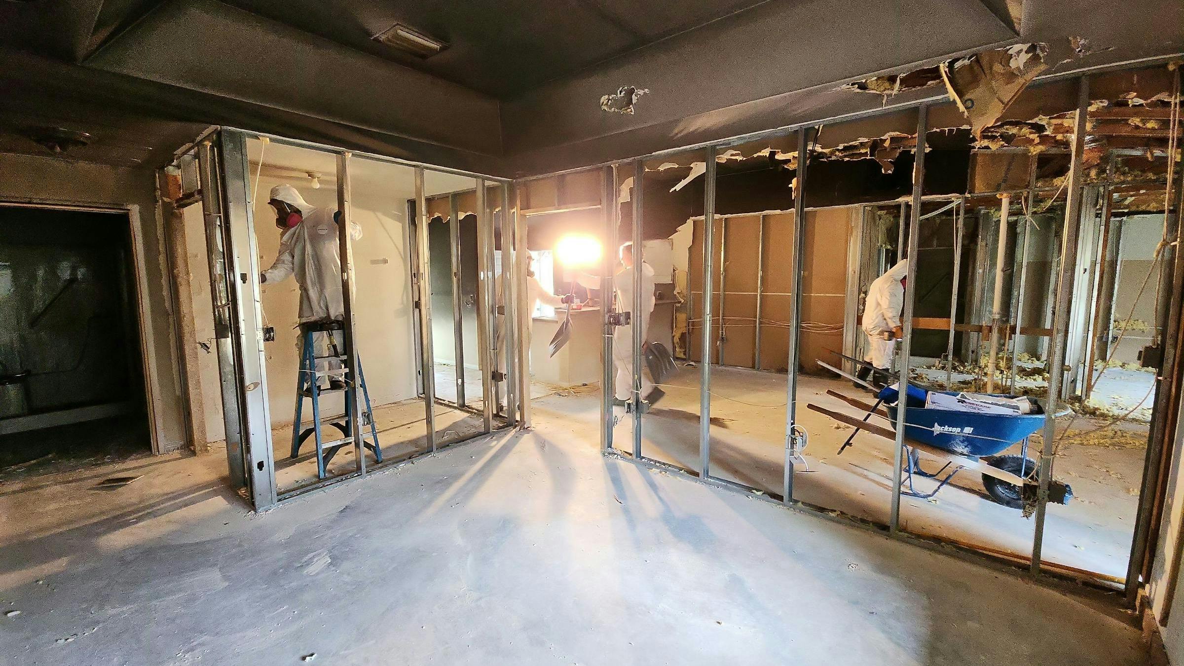 Matt Black&rsquo;s DRYmedic technicians wear personal protective equipment while removing drywall in a customer&rsquo;s home.