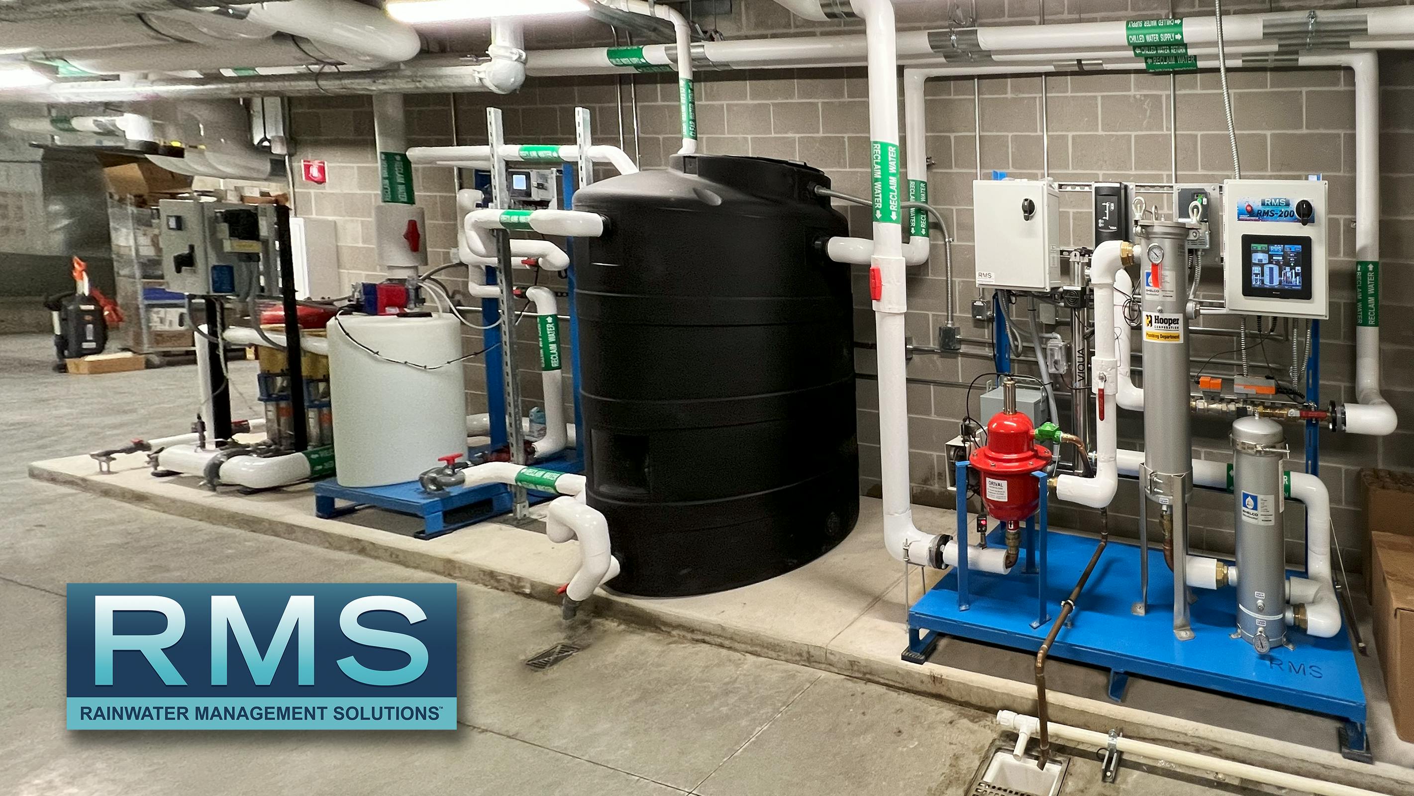 Hooper&rsquo;s new corporate HQ and fabrication facility includes a complete commercial rainwater harvesting system from RMS. Water is captured from the roof and stored in a below ground concrete cistern. Water is transferred with a submersible pump through an RMS treatment skid (pictured) and stored in a 1000-gallon day tank that is injected and recirculated with chlorine.