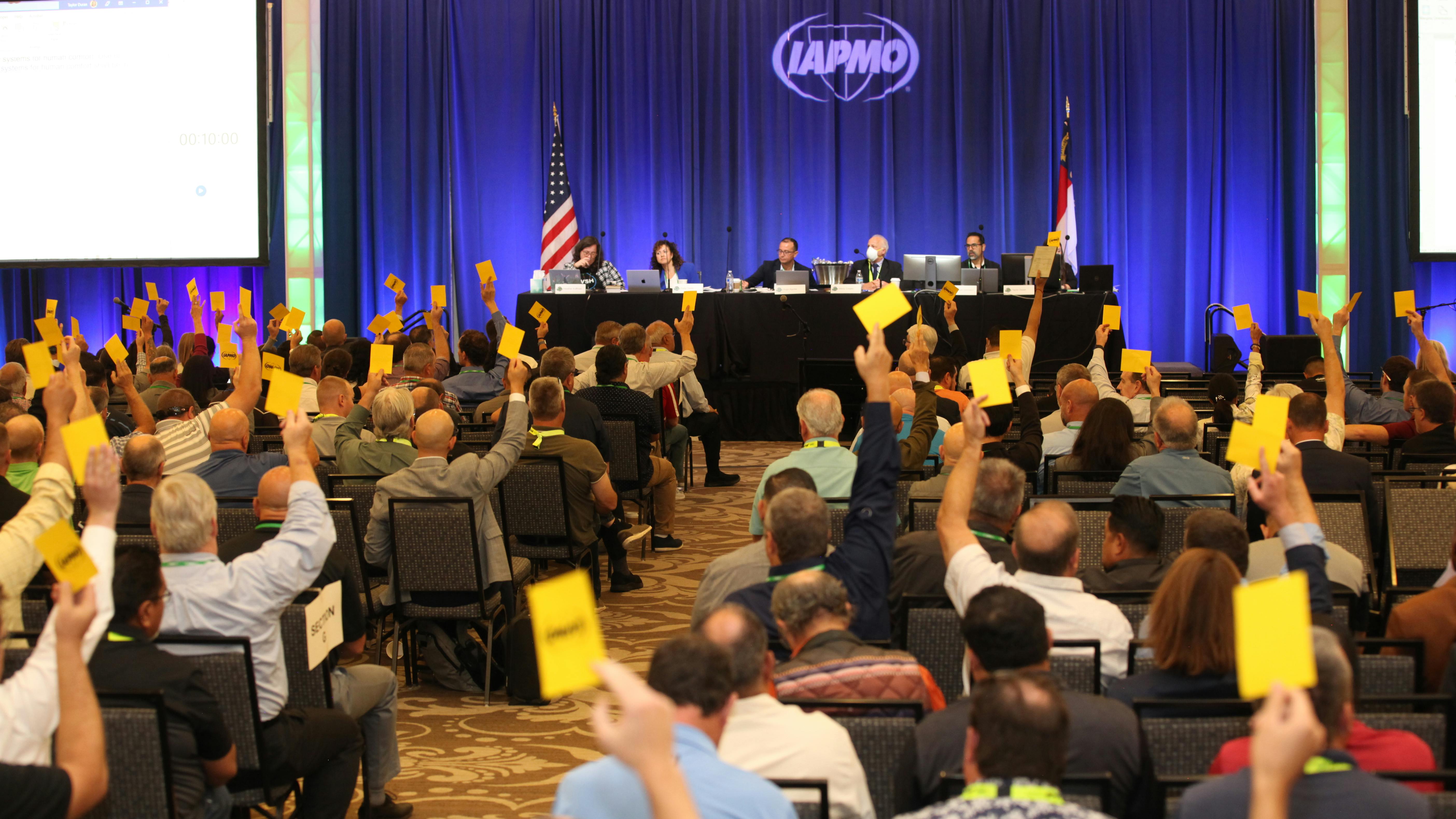 The Codes Committee voting at the 94th Education and Business Conference.