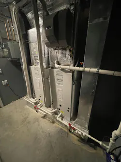 Two air handlers connected via line sets to compressor sections. Two air handlers connected via line sets to compressor sections.