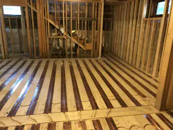 Marking loop routes on radiant copper panels. Marking loop routes on radiant copper panels.