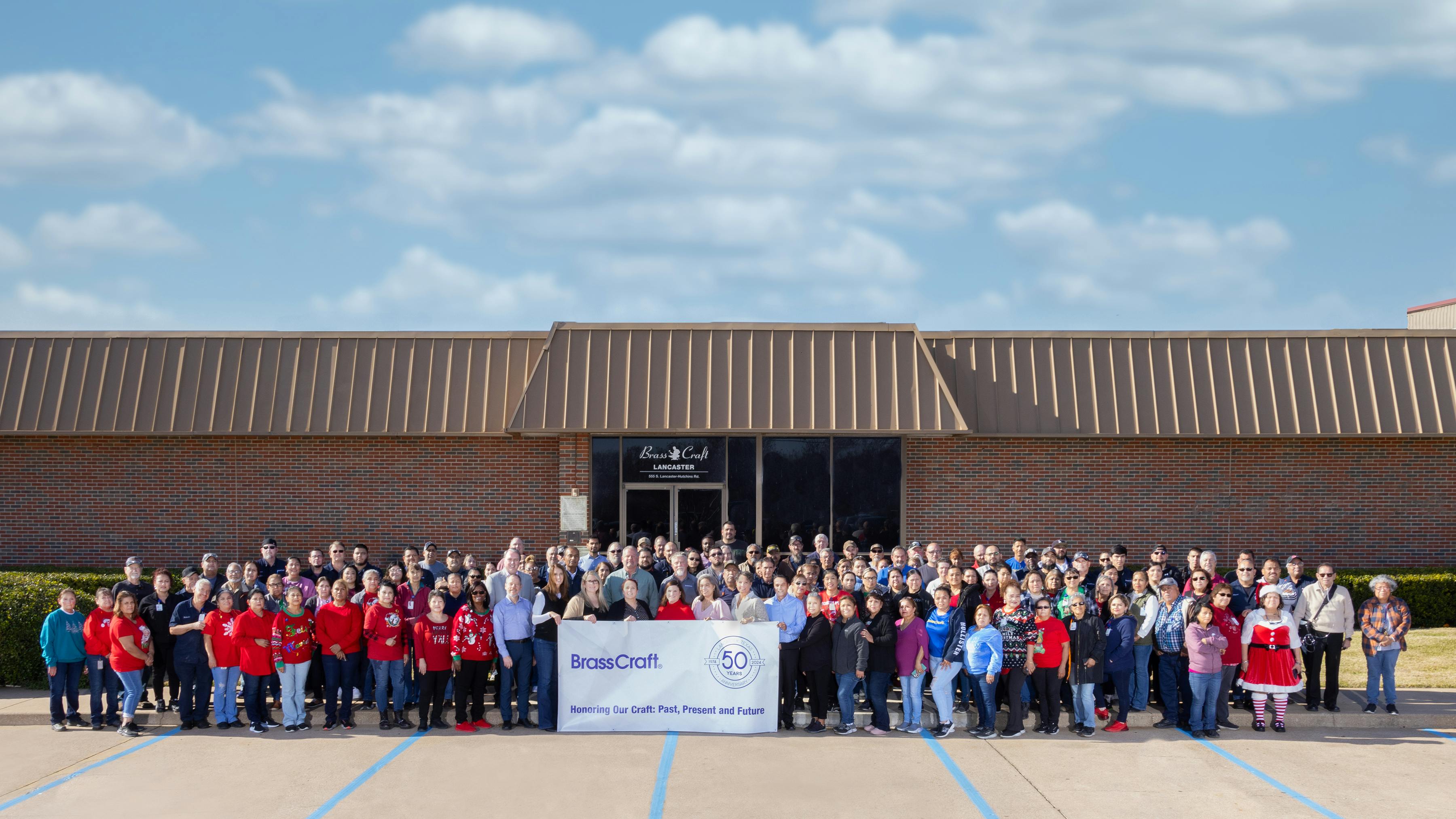 BrassCraft employees outside the Lancaster, TX facility.