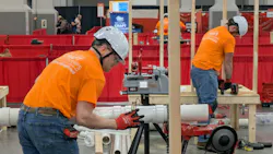 Competitors in the plumbing competition fit sections of PVC pipe during the 36th National Craft Competition. Competitors in the plumbing competition fit sections of PVC pipe during the 36th National Craft Competition.