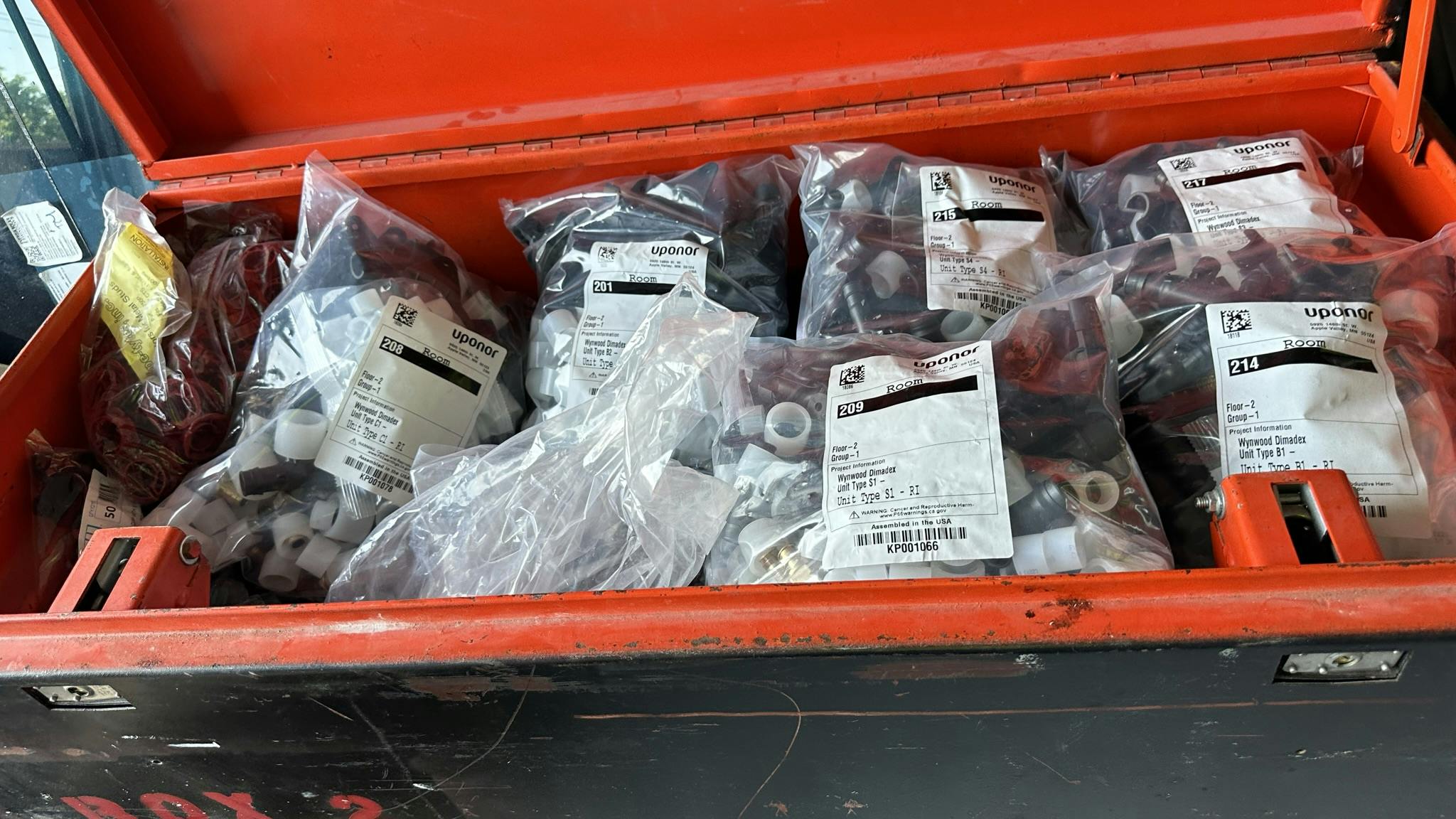 Kitting services provide clear plans and neatly packaged fittings, rings, multiports, and accessories for each individual unit.