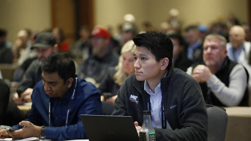 An audience member during an educational session at Work Truck Week 2025.