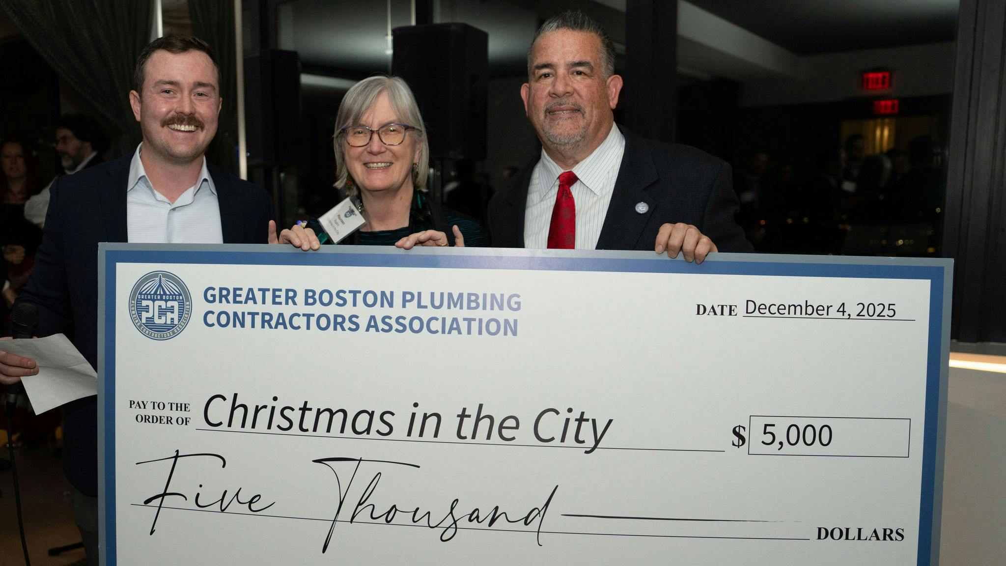 (Left to right) Greater Boston PCA Executive Director Andrew DeAngelo; Maureen Rogers, Christmas in the City; and Greater Boston PCA President Kenneth Reagan.
