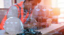 an engineer working on table in site office with hardhat an engineer working on table in site office with hardhat