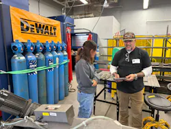 Working in the shop. Working in the shop.