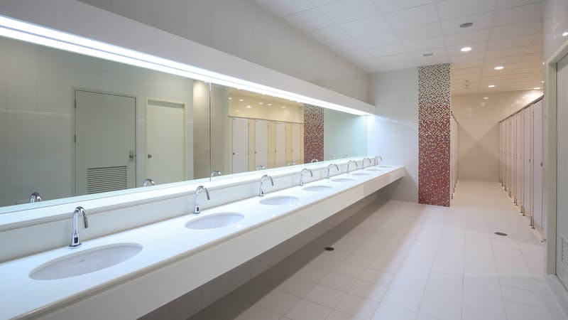 Line of sinks in a commercial restroom.