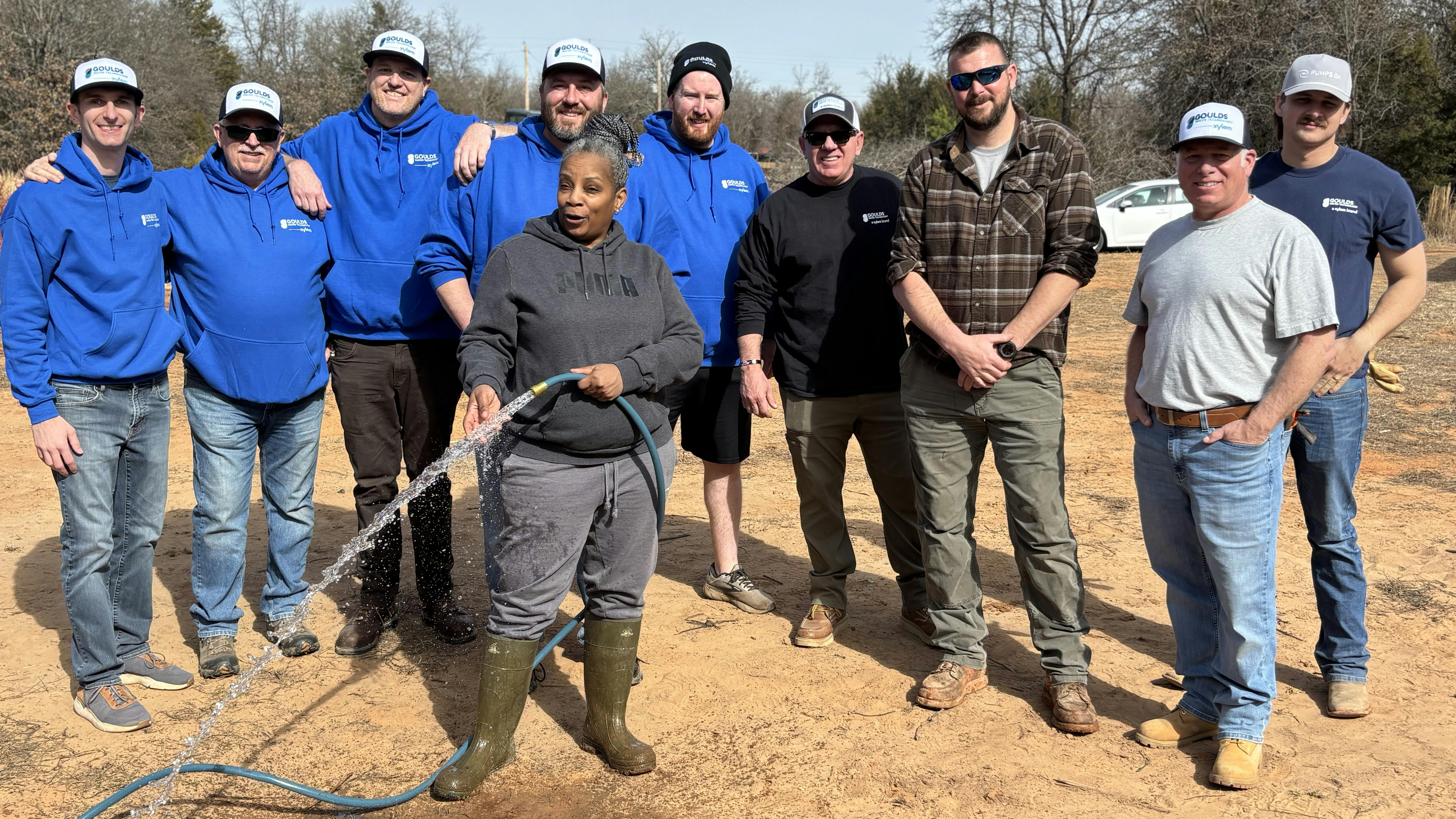 Dana Adams (with hose) along with volunteers.