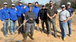 Dana Adams (with hose) along with volunteers. Dana Adams (with hose) along with volunteers.