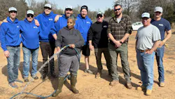 Dana Adams (with hose) along with volunteers. Dana Adams (with hose) along with volunteers.