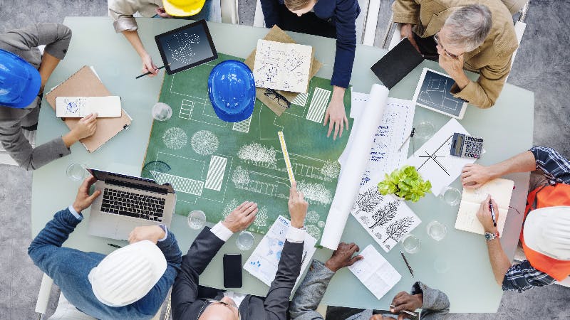 Architects Planning Around the Conference Table.