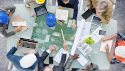 Architects Planning Around the Conference Table. Architects Planning Around the Conference Table.