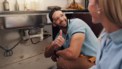 plumber with satisfied customer plumber with satisfied customer