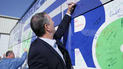 Watchfire Signs President and CEO Steve Harriott signs the Makers on the Move tour bus on its Oct. 13 stop at Watchfire Signs in Danville, Ill. Watchfire Signs President and CEO Steve Harriott signs the Makers on the Move tour bus on its Oct. 13 stop at Watchfire Signs in Danville, Ill.