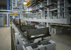 Figure 2: A 20-meter-high building towers between the administration facilities and the new production halls, accommodating a high-bay warehouse and sawing center. Figure 2: A 20-meter-high building towers between the administration facilities and the new production halls, accommodating a high-bay warehouse and sawing center.