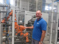 Figure 6: The robot automatically attaches a barcode to the cut pieces. Figure 6: The robot automatically attaches a barcode to the cut pieces.