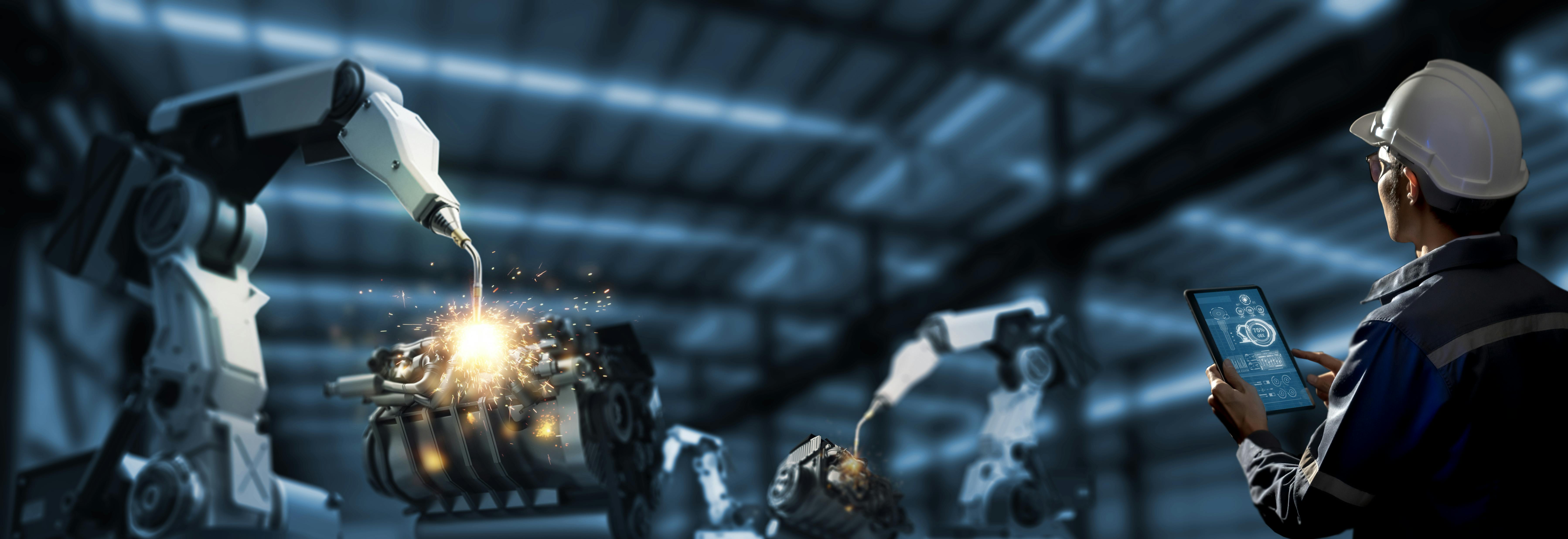 Engineer check and control robotics automatic arms machine in intelligent and digital manufacturing operation on real time monitoring system software.