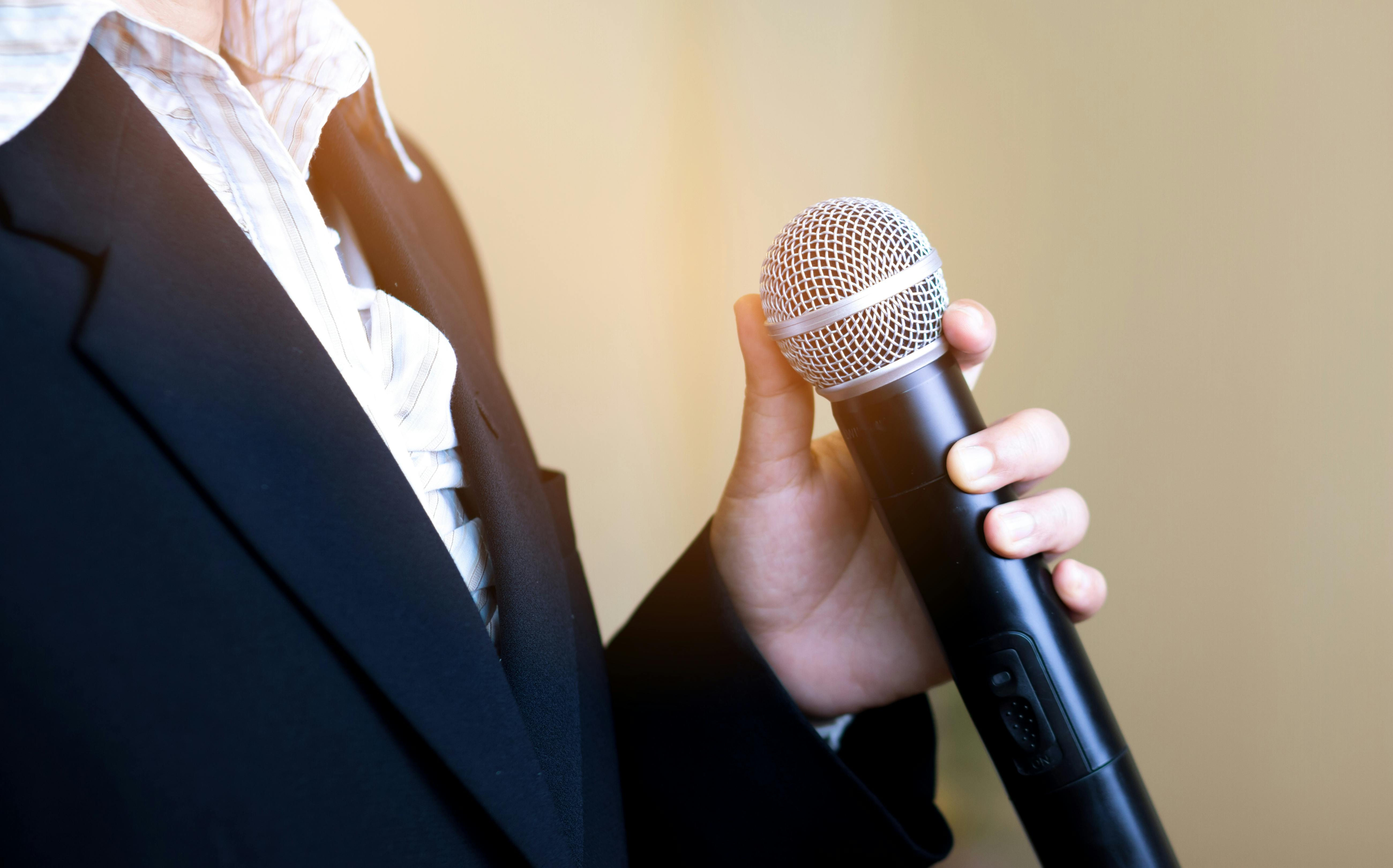 Woman speaking into a microphone