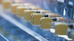 Photoelectric Sensor installed in a row of industrial machine in a factory. Photo sensor for object detection in machine factory. Photoelectric Sensor installed in a row of industrial machine in a factory. Photo sensor for object detection in machine factory.