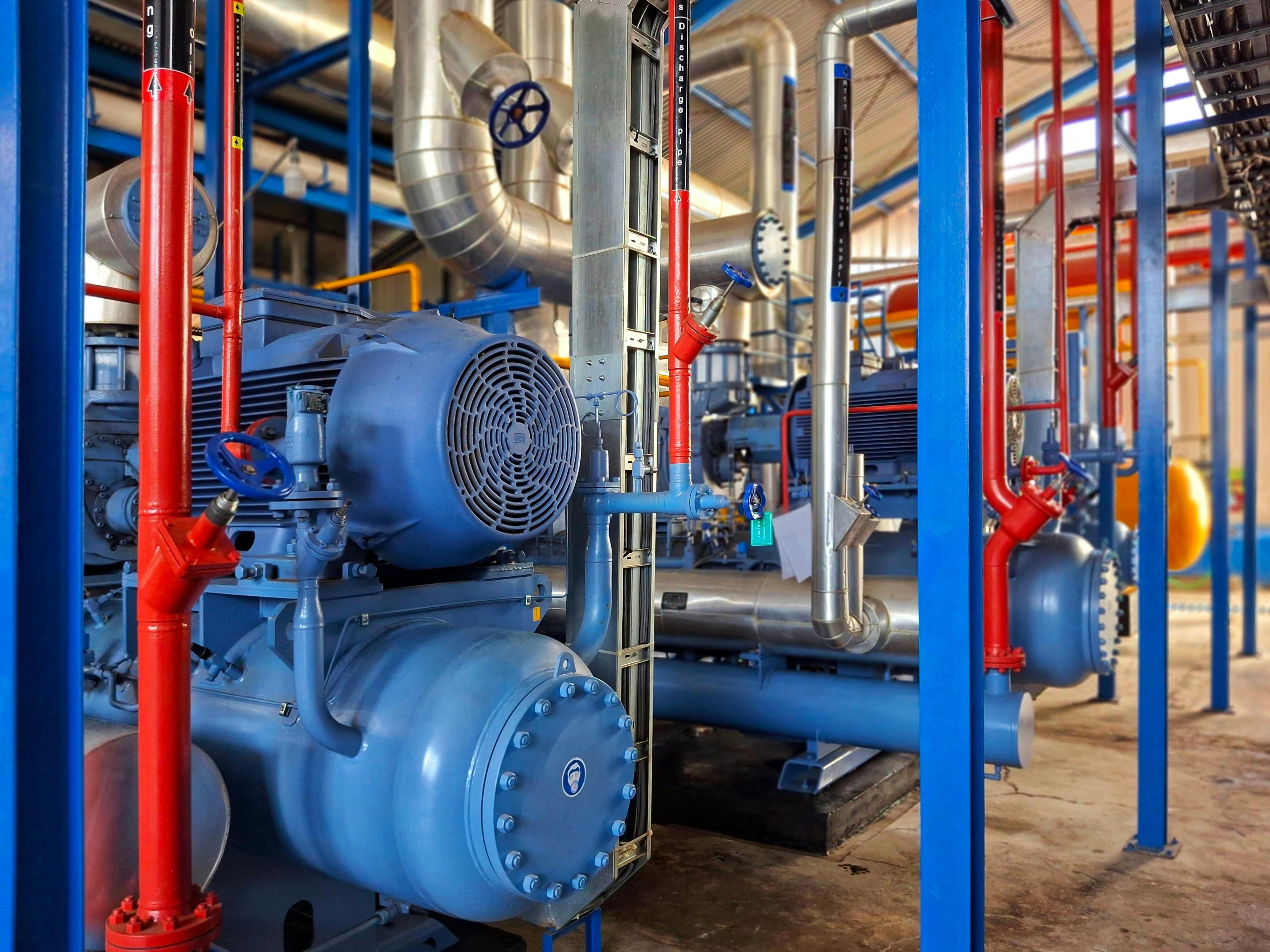 Industrial machinery. Industrial chiller installation. Industrial cooling system. Liquid supply pipe. Mechanism of air conditioning system in industry. Ammonia tube