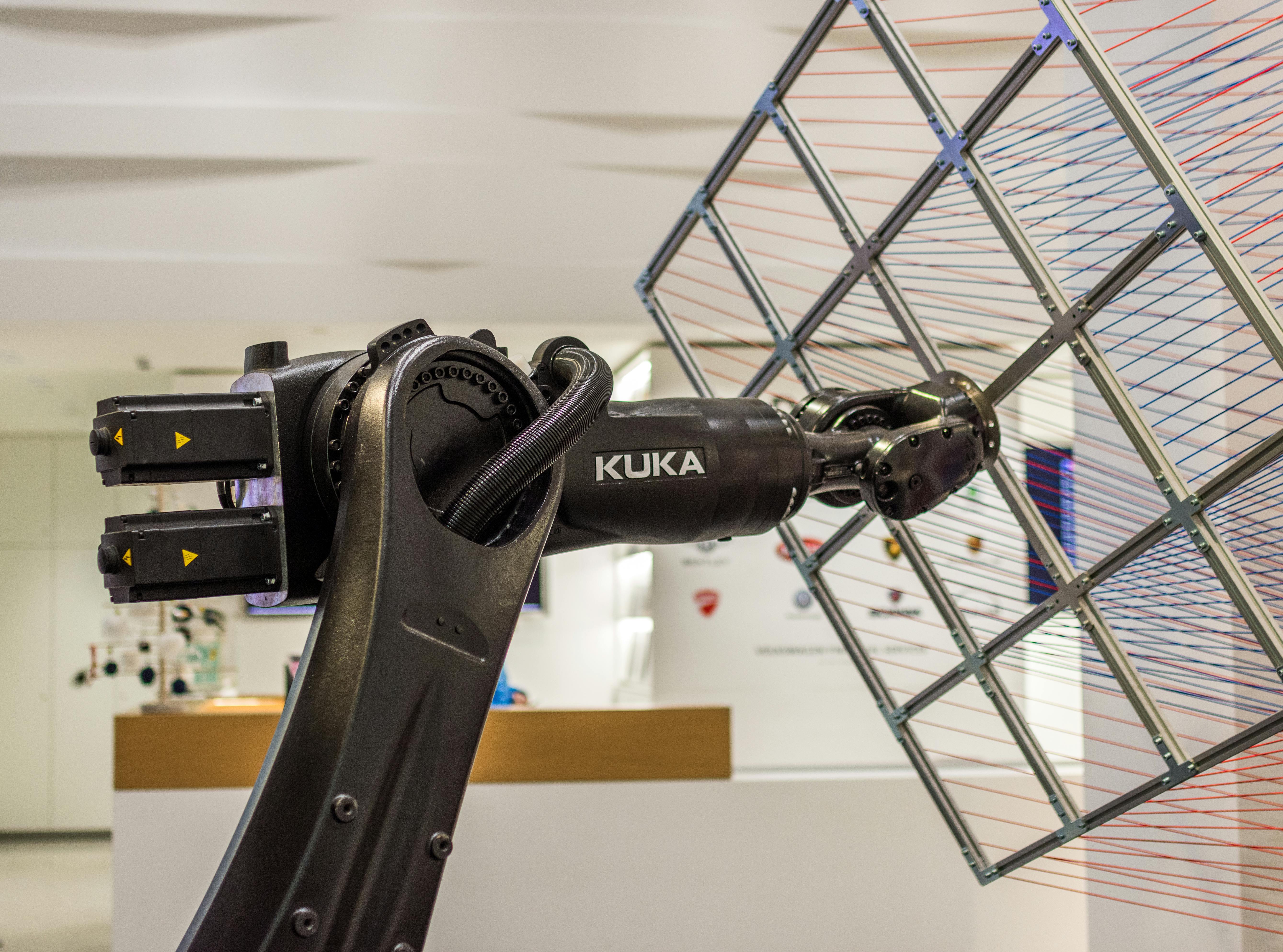 Kuka robot on Schunk assembly electronics line