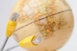 Connection between technology and geography seen through network cables and a globe Connection between technology and geography seen through network cables and a globe